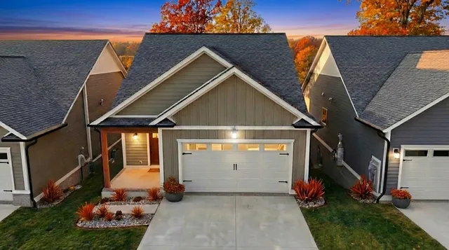 a view of a patio with dining table and chairs with a yard