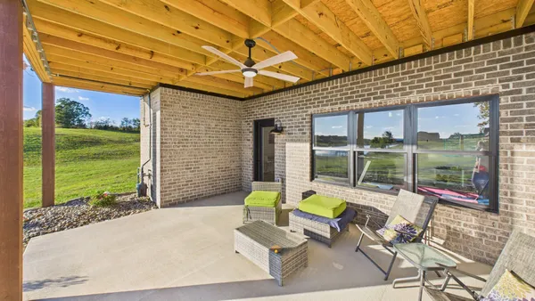 an aerial view of a residential houses with outdoor space
