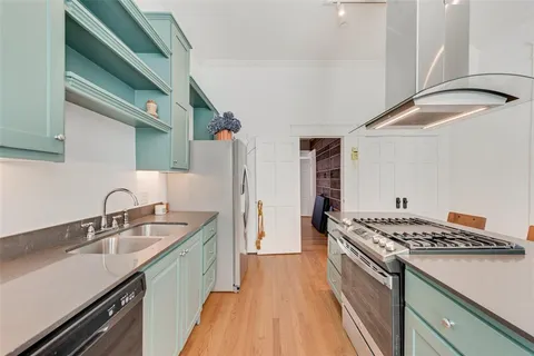 a kitchen that has a sink and a stove