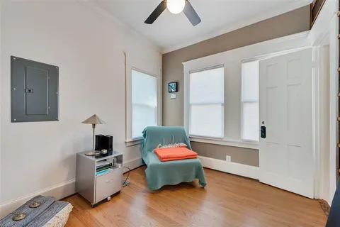 a bedroom with furniture and window