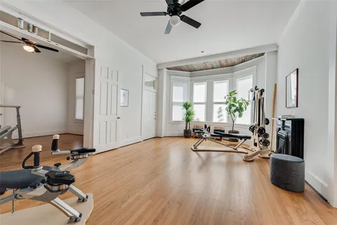 a view of a livingroom with workspace and a window