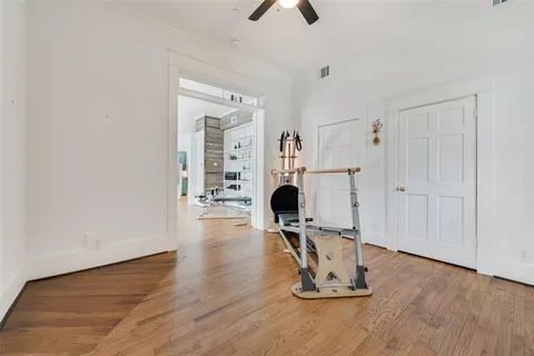 a work room with furniture and gym equipment