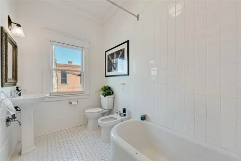 a bathroom with a bathtub sink and toilet