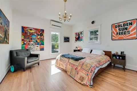 a bedroom with bed and a window