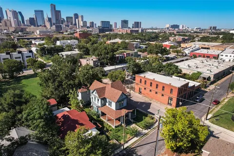 an aerial view of residential houses with outdoor space