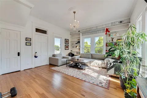 a living room with furniture or window and a wooden floor