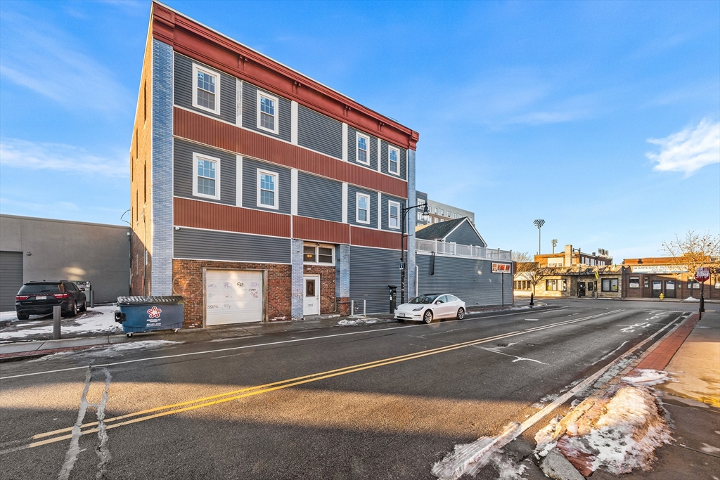 64 Green Street Worcester, MA 01604 - Photo 2 of 11 a street view along with residential houses