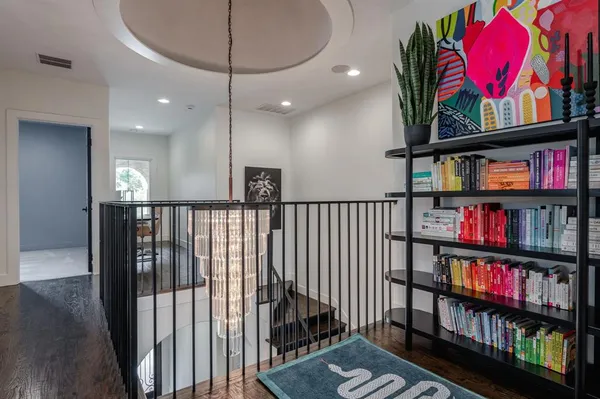 a view of a hallway with book shelf