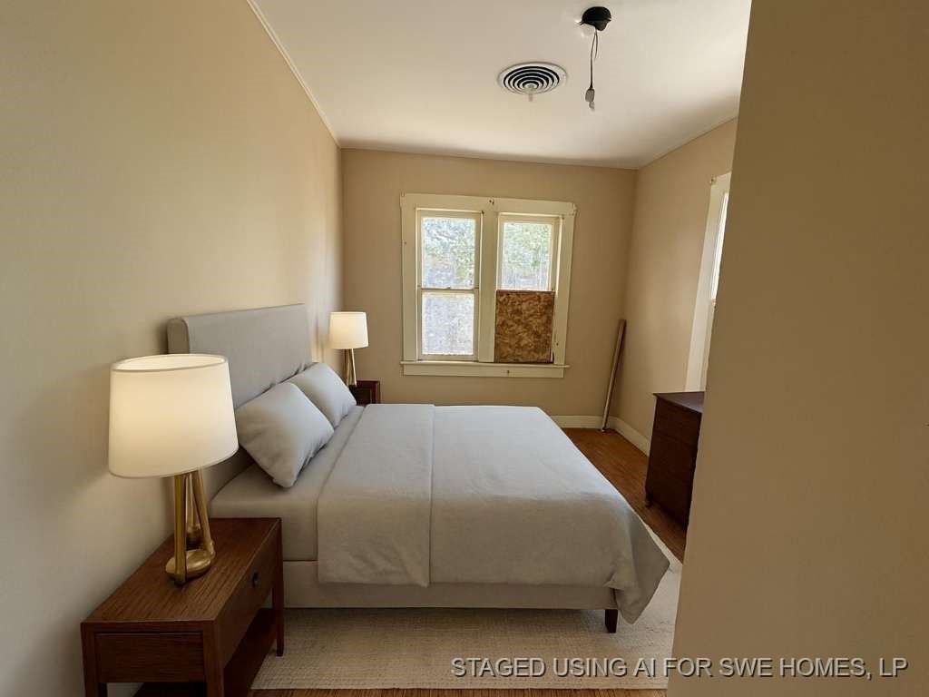 807 Lexington Plainview, TX 79072 - Photo 9 of 10 a bedroom with a bed and window