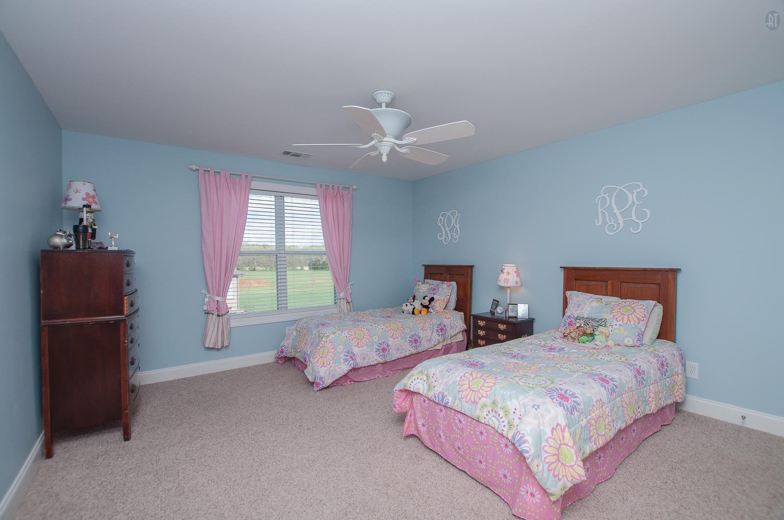 2172 Holloway Road Lebanon, TN 37090 - Photo 14 of 21 a bedroom with two beds and a chandelier