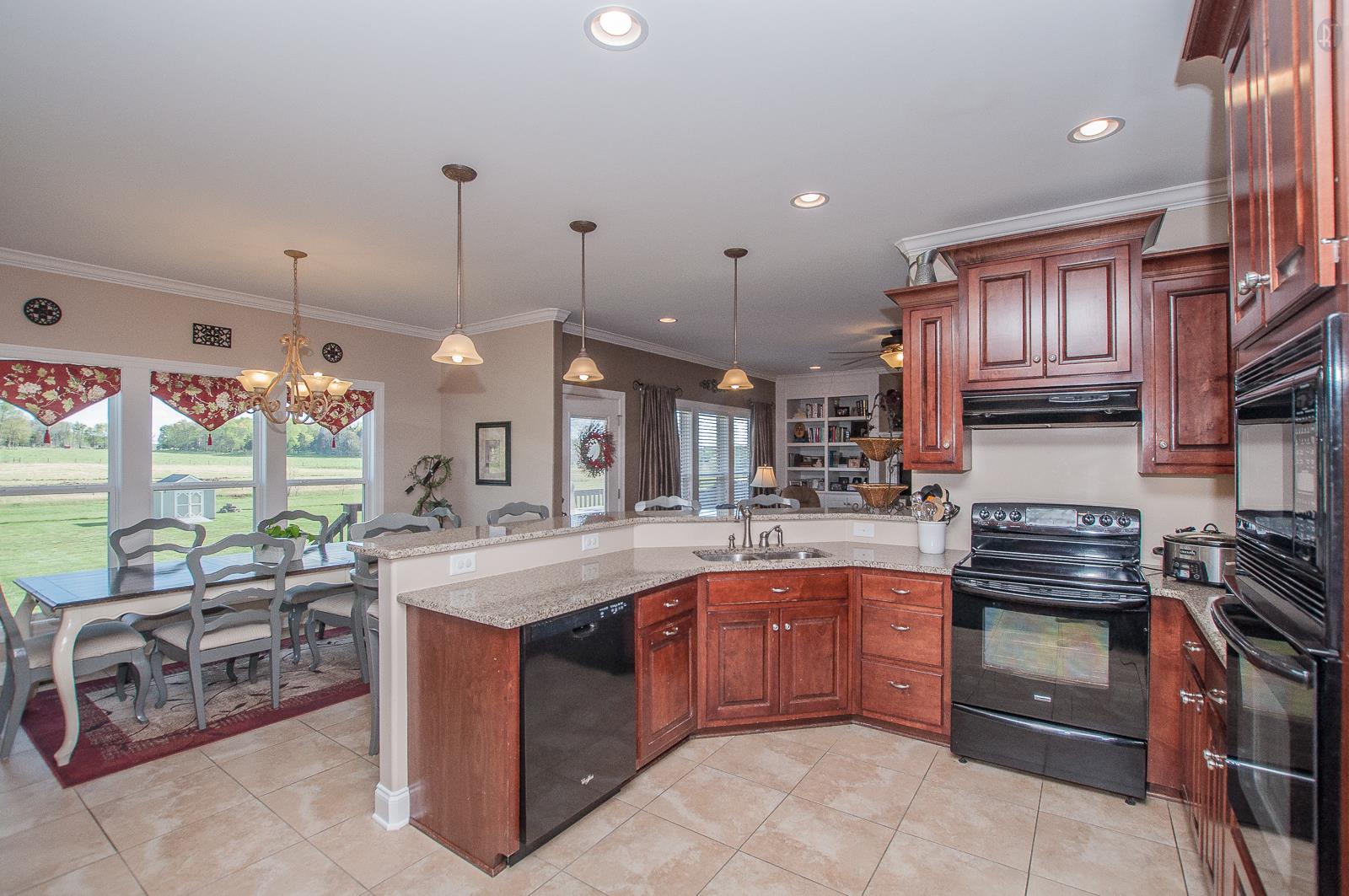 2172 Holloway Road Lebanon, TN 37090 - Photo 4 of 21 a kitchen with stainless steel appliances granite countertop a stove a sink and a refrigerator