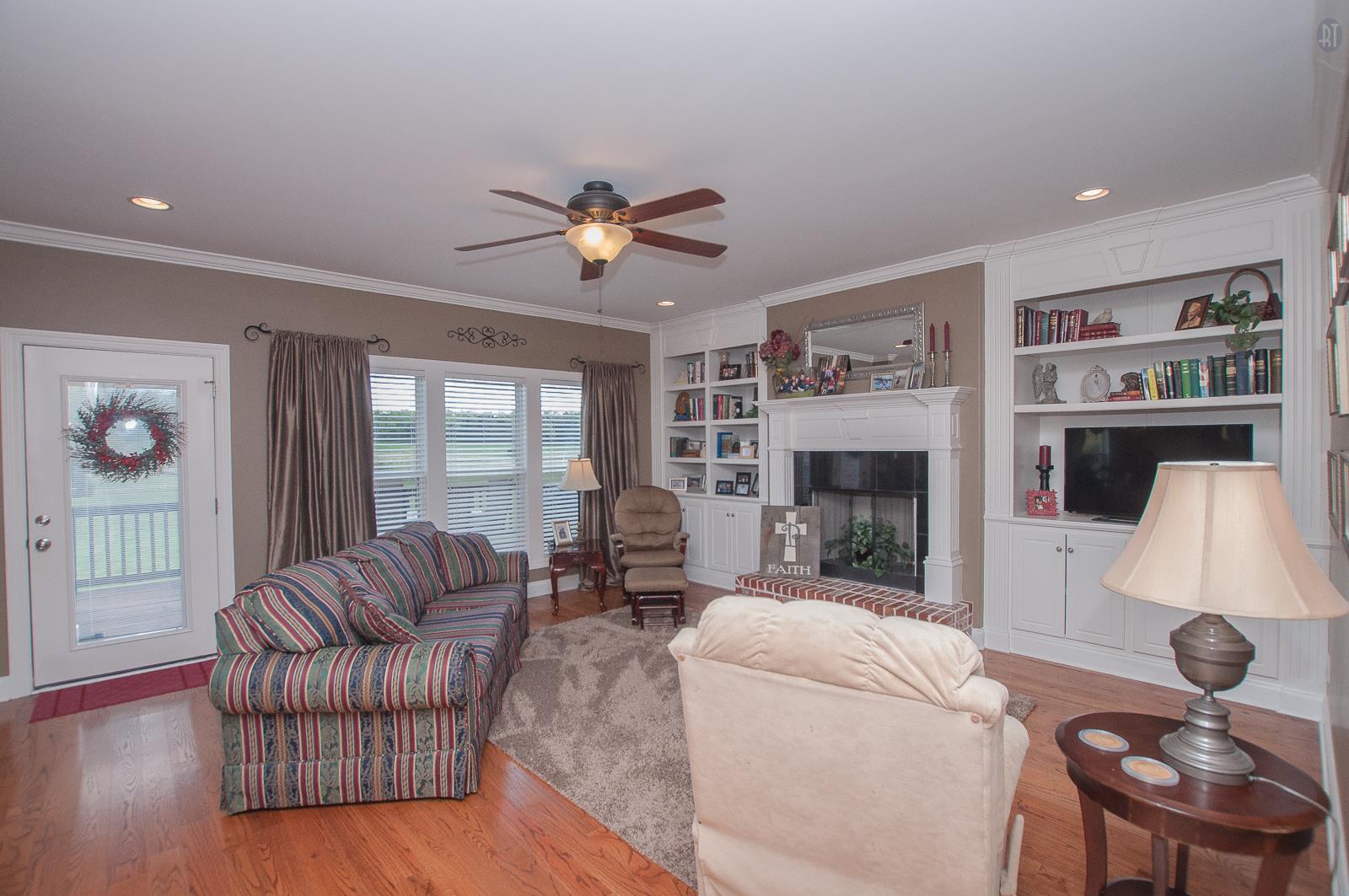 2172 Holloway Road Lebanon, TN 37090 - Photo 6 of 21 a living room with furniture fireplace and a flat screen tv