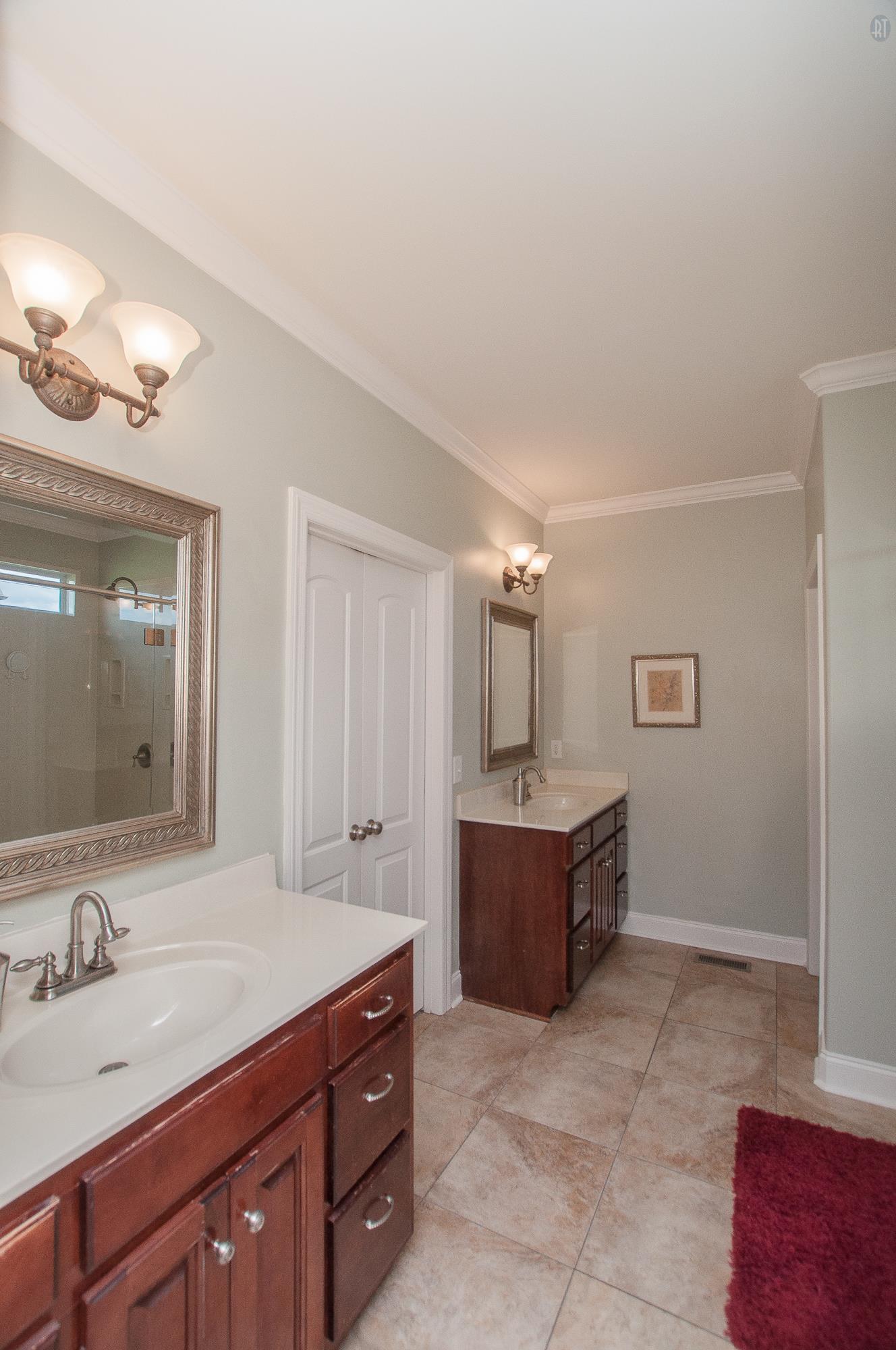2172 Holloway Road Lebanon, TN 37090 - Photo 9 of 21 a spacious bathroom with a granite countertop sink a mirror and a bathtub