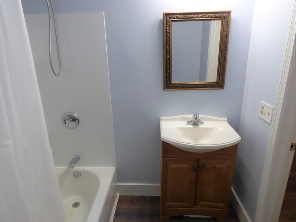 2194-2196 Main Street Three Rivers, MA 01080 - Photo 13 of 28 a bathroom with a sink a toilet and shower