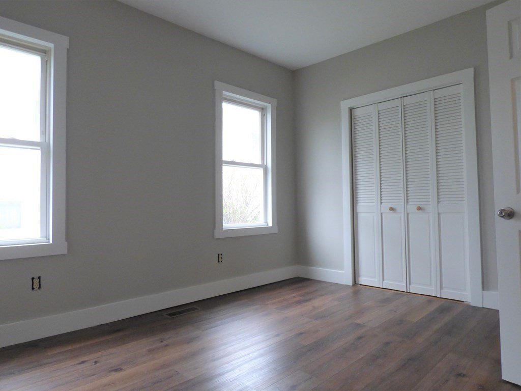 2194-2196 Main Street Three Rivers, MA 01080 - Photo 15 of 28 an empty room with wooden floor and windows