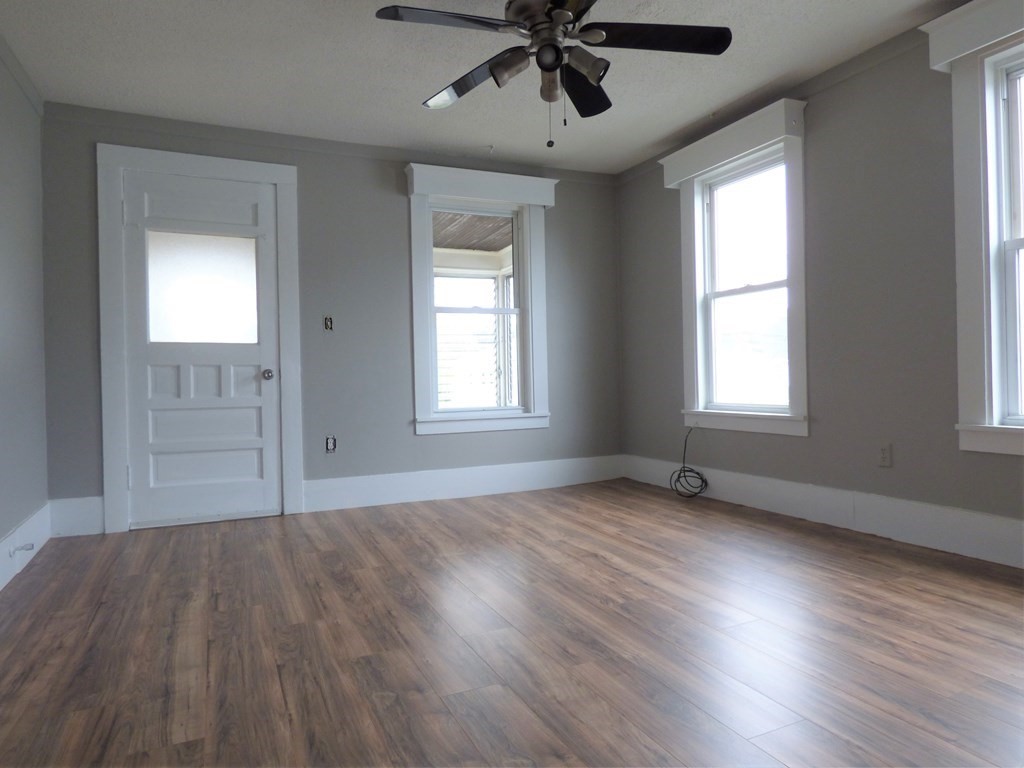 2194-2196 Main Street Three Rivers, MA 01080 - Photo 16 of 28 a view of an empty room with wooden floor and a window