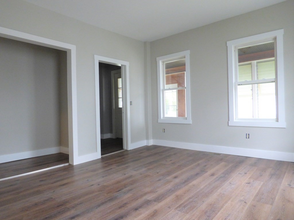 2194-2196 Main Street Three Rivers, MA 01080 - Photo 17 of 28 a view of an empty room with wooden floor and a window