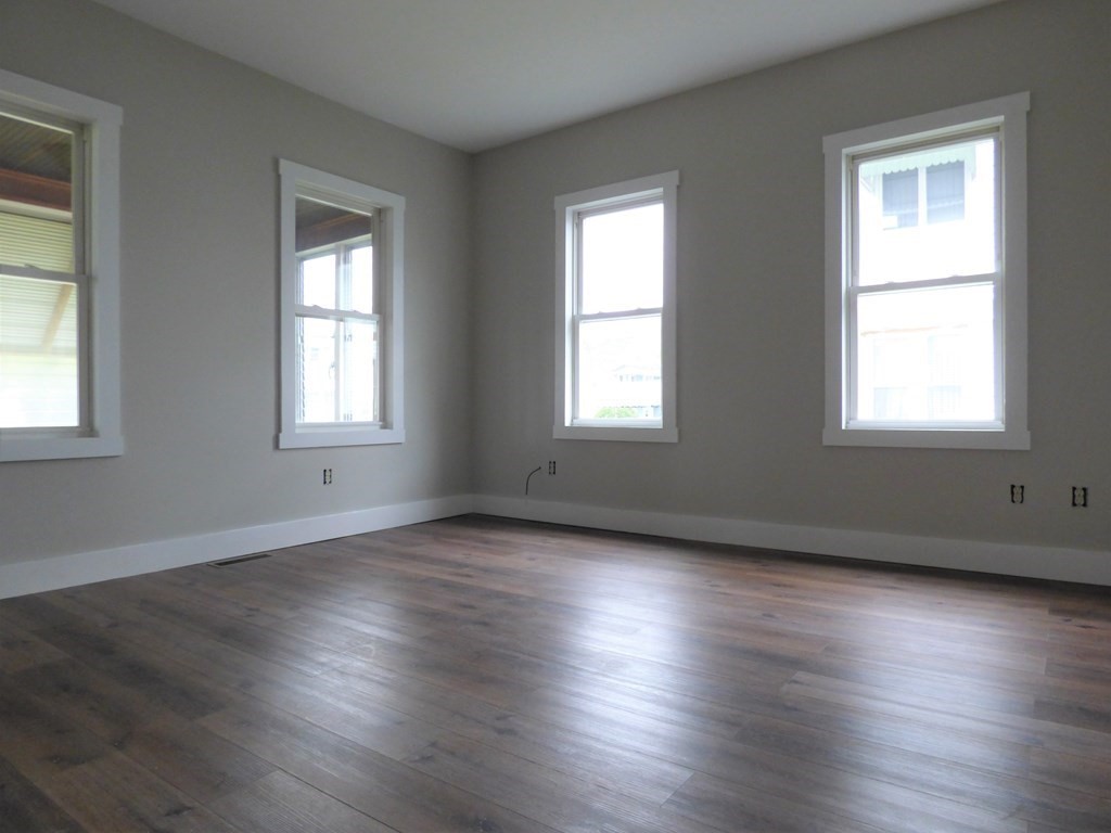 2194-2196 Main Street Three Rivers, MA 01080 - Photo 18 of 28 an empty room with wooden floor and windows