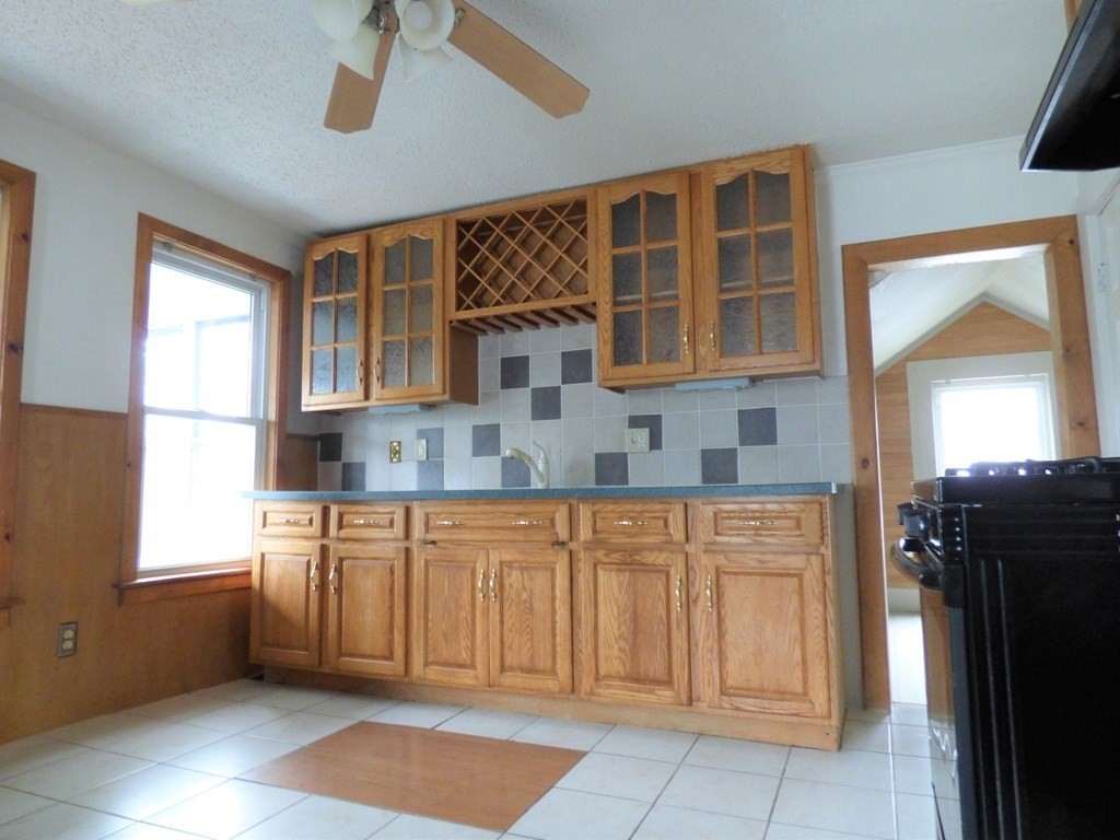 2194-2196 Main Street Three Rivers, MA 01080 - Photo 20 of 28 a kitchen with a sink window and cabinets