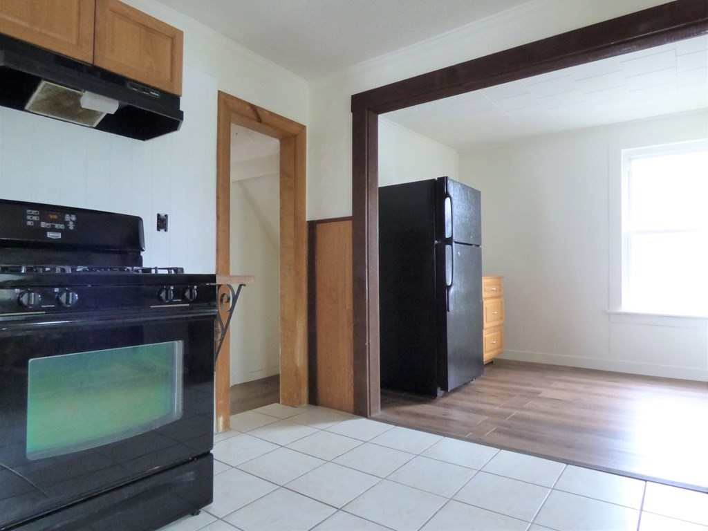 2194-2196 Main Street Three Rivers, MA 01080 - Photo 21 of 28 a kitchen with stainless steel appliances granite countertop a refrigerator and a stove top oven