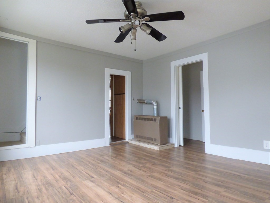 2194-2196 Main Street Three Rivers, MA 01080 - Photo 23 of 28 a view of a room with wooden floor and a ceiling fan