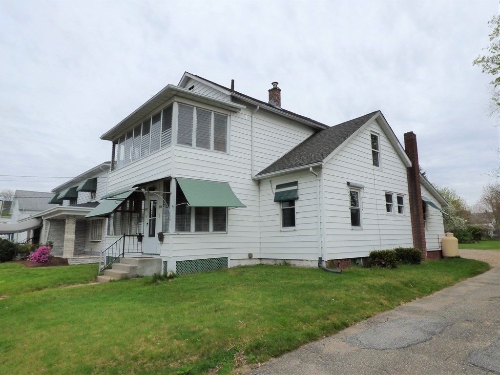 2194-2196 Main Street Three Rivers, MA 01080 - Photo 3 of 28 a front view of a house with a yard