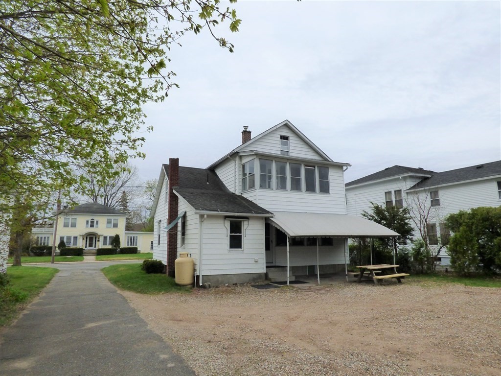 2194-2196 Main Street Three Rivers, MA 01080 - Photo 5 of 28 a view of a house with a yard and garage