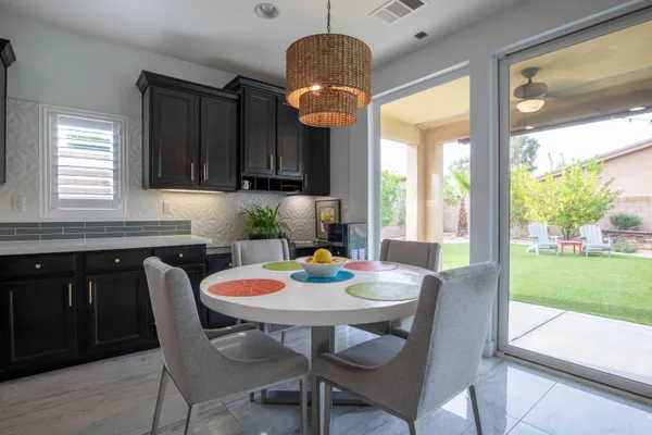 a dining room with furniture and window