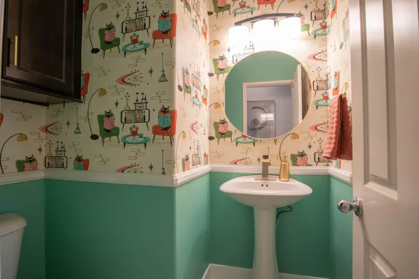 a bathroom with a sink and a mirror
