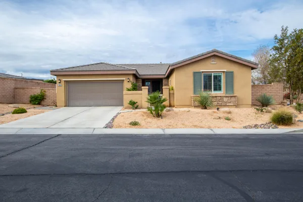 a front view of a house with yard