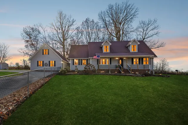 a front view of house with yard and green space