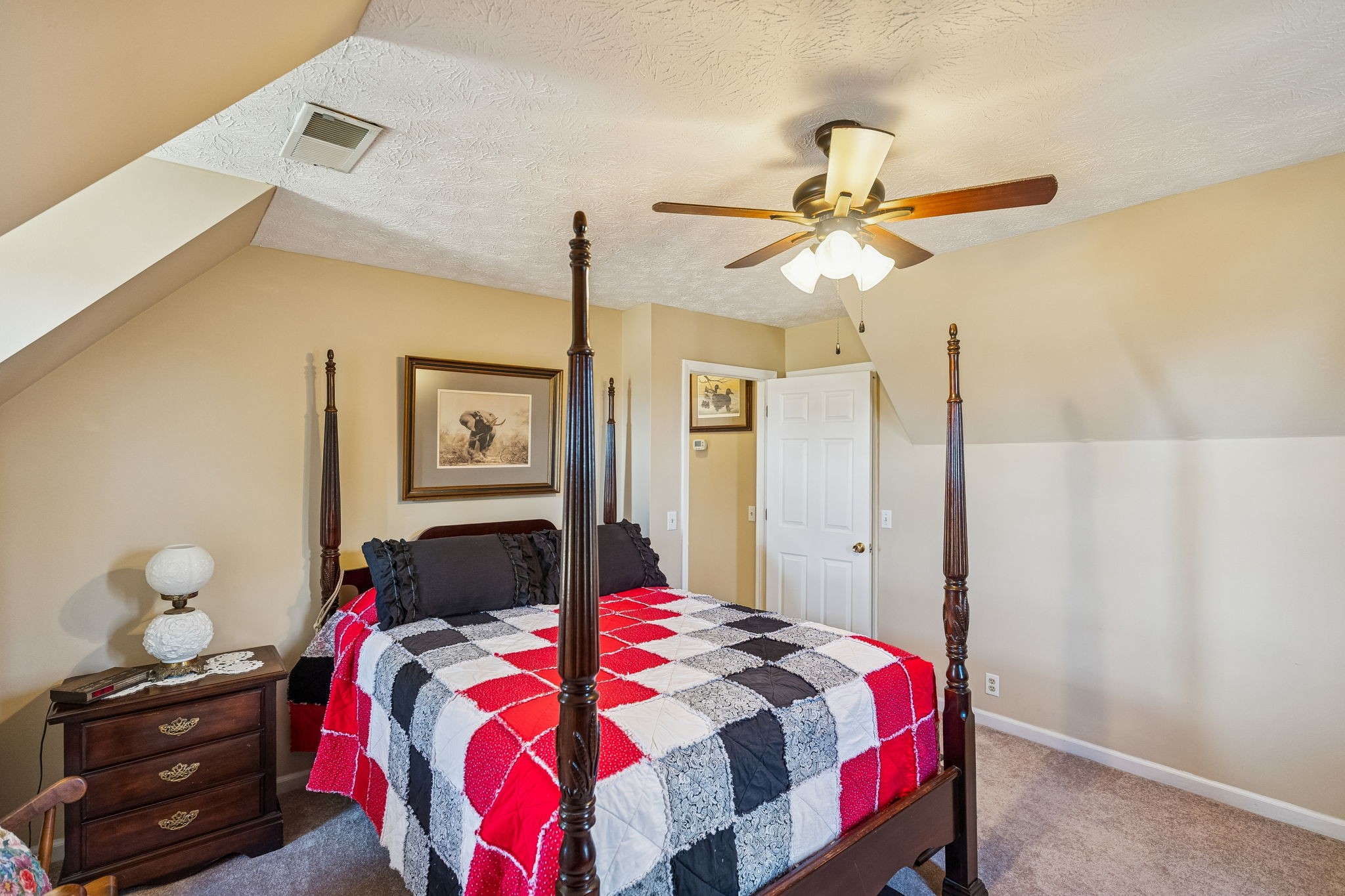 524 Willie Jarvis Road Sparta, TN 38583 - Photo 28 of 59 a bedroom with a bed and a chandelier