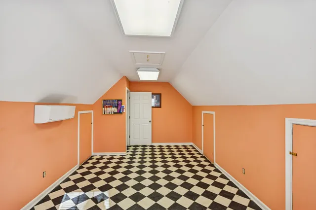 a view of a house with a yard and sitting area