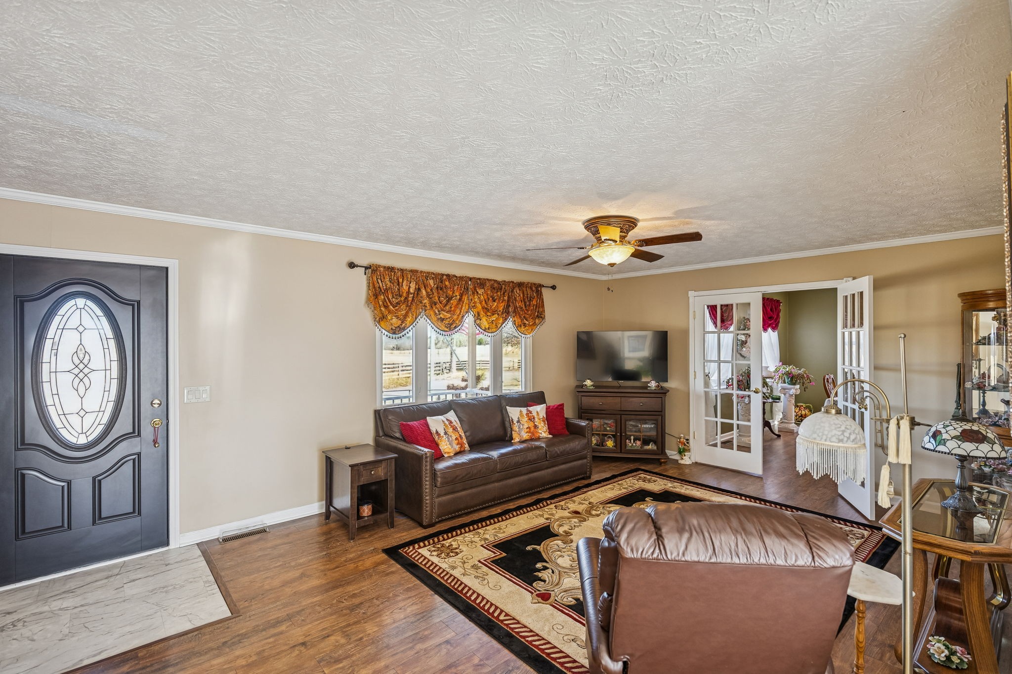 524 Willie Jarvis Road Sparta, TN 38583 - Photo 5 of 59 a living room with furniture a window and a flat screen tv