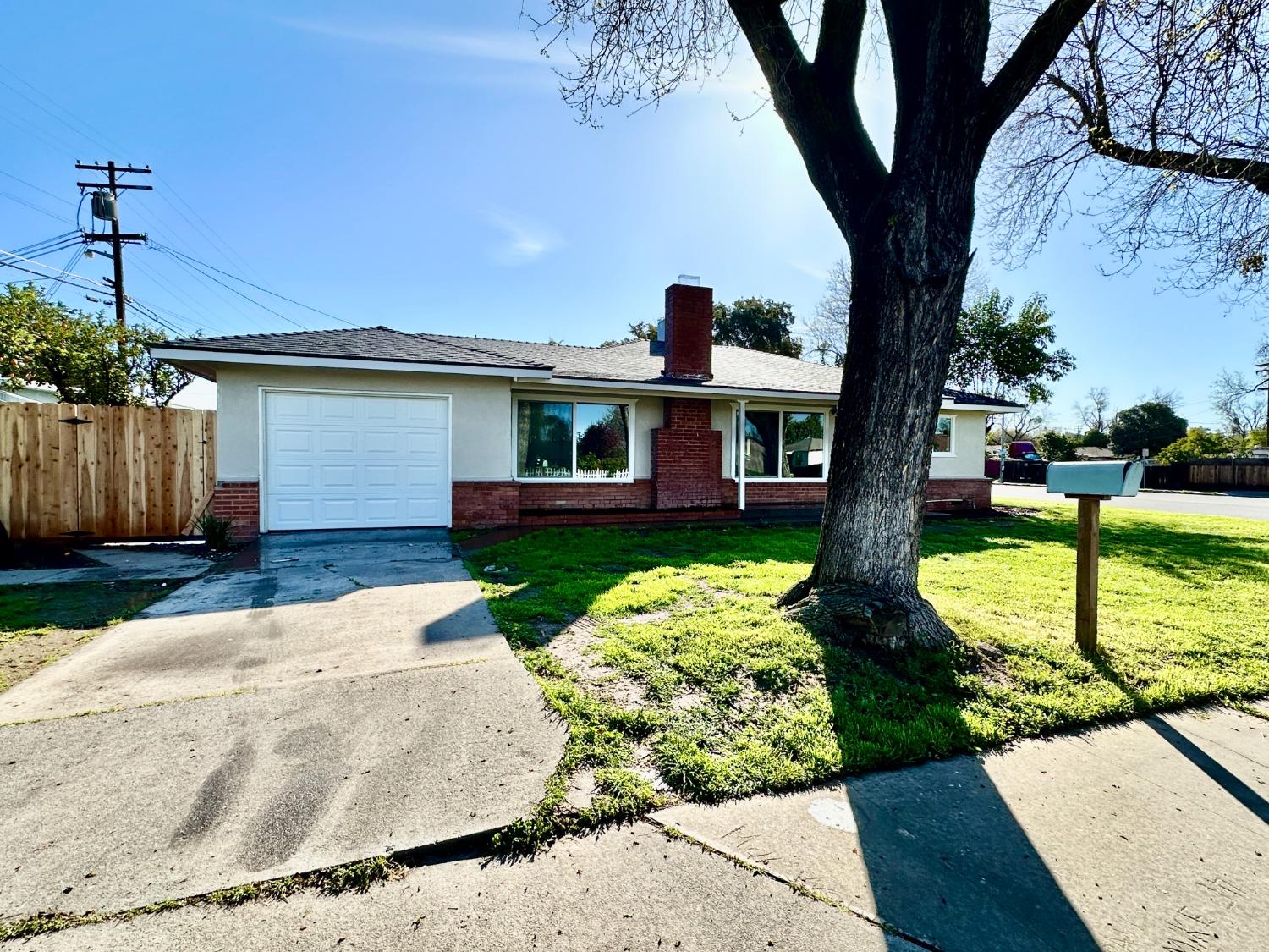 1404 Grape Avenue Modesto, CA 95350 - Photo 1 of 1 a front view of a house with garden