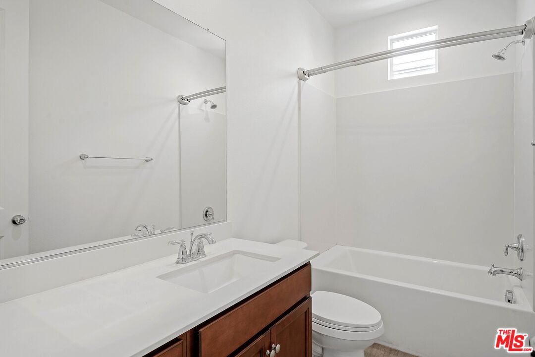 659 Daniel Freeman Circle Inglewood, CA 90301 - Photo 23 of 34 a bathroom with a sink a toilet and shower