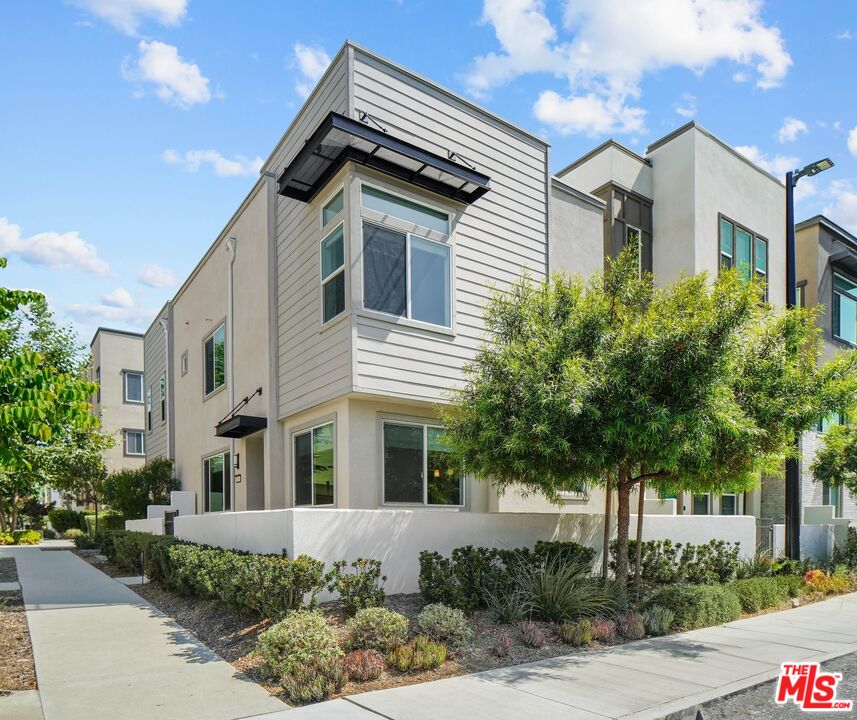 659 Daniel Freeman Circle Inglewood, CA 90301 - Photo 29 of 34 a front view of a house with plants and trees