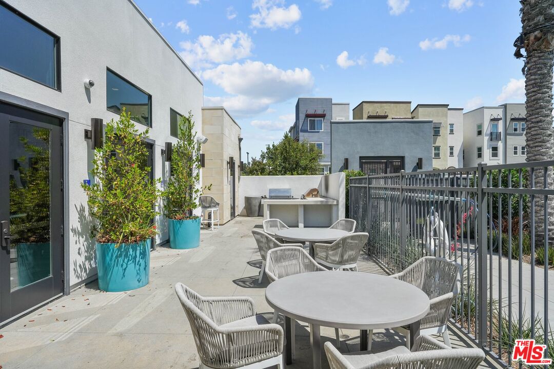 659 Daniel Freeman Circle Inglewood, CA 90301 - Photo 33 of 34 a balcony with furniture and potted plants