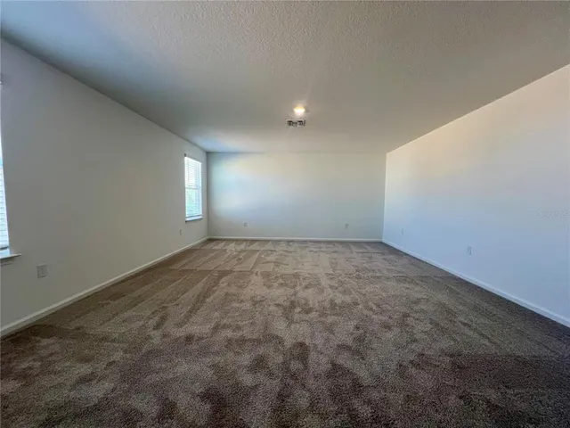 an empty room with a empty space and window