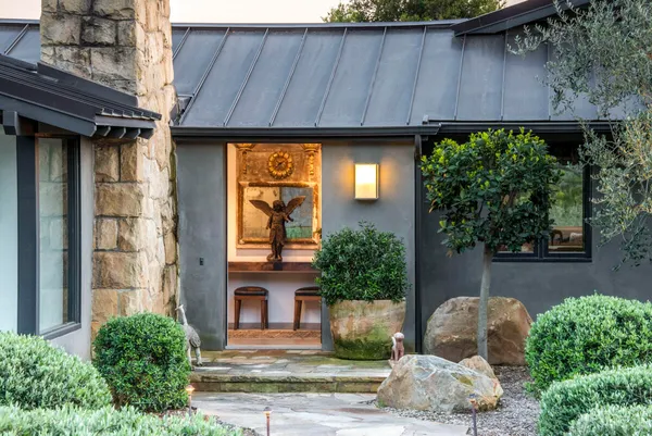 a front view of a house with garden