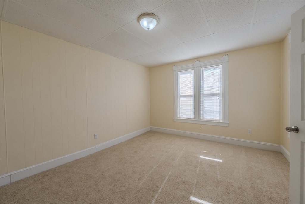 348 Walker Street Lowell, MA 01851 - Photo 13 of 20 an empty room with a empty space and windows