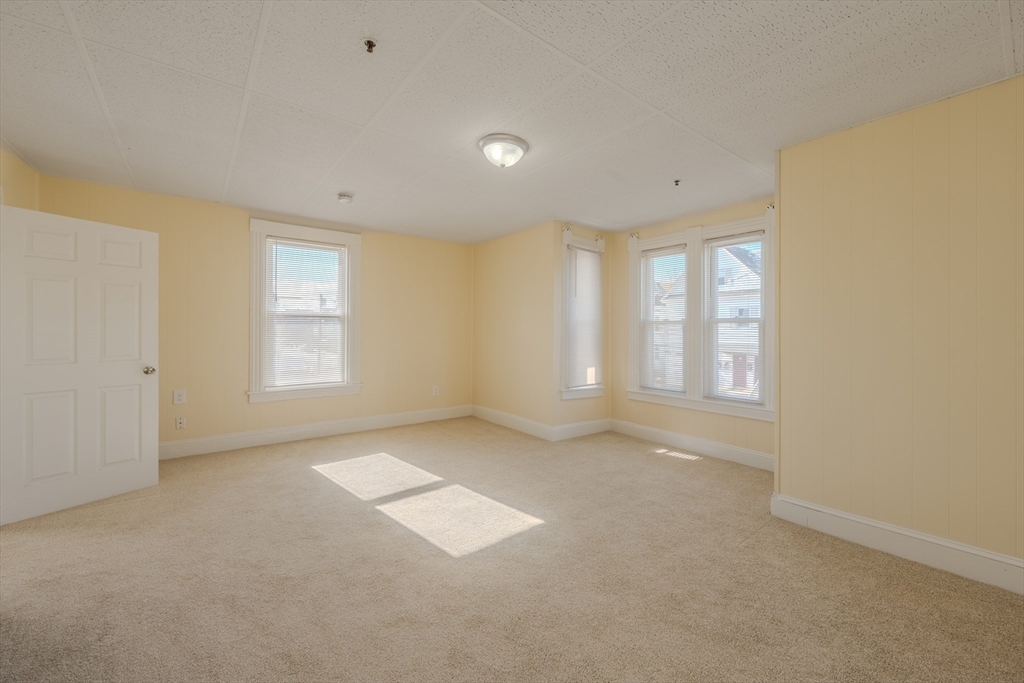 348 Walker Street Lowell, MA 01851 - Photo 14 of 20 a view of an empty room with a window