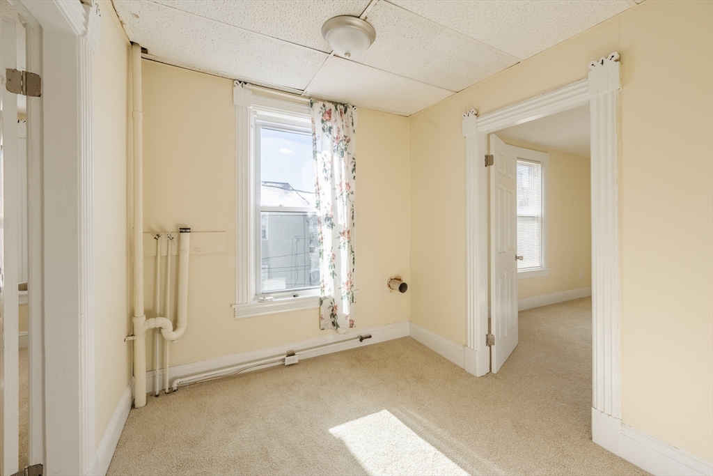 348 Walker Street Lowell, MA 01851 - Photo 16 of 20 a view of an empty room with a window