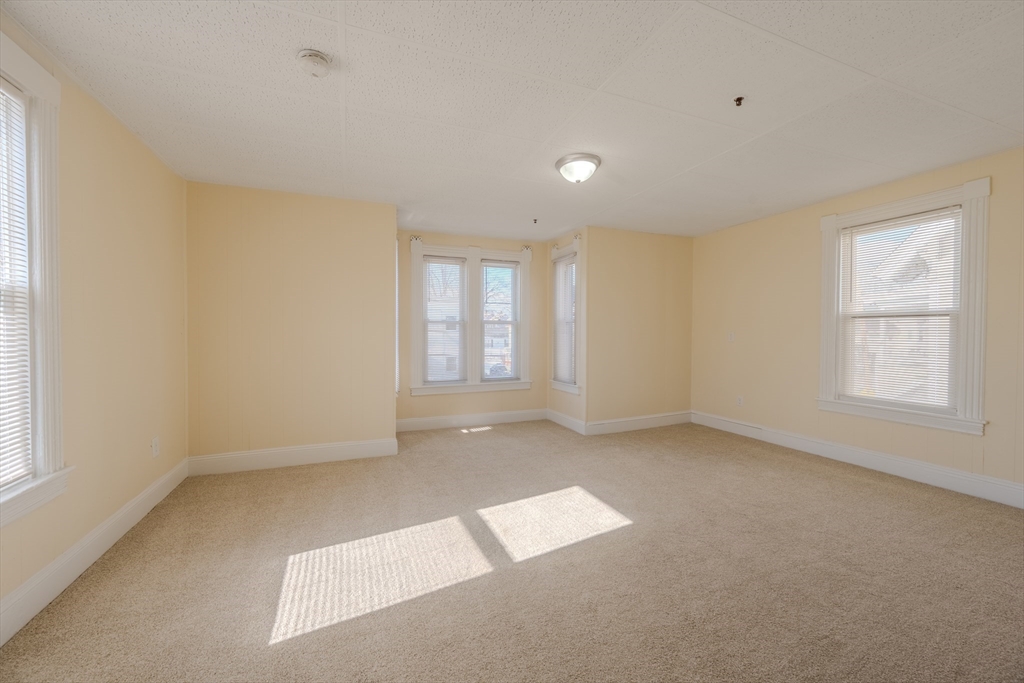 348 Walker Street Lowell, MA 01851 - Photo 10 of 20 an empty room with windows