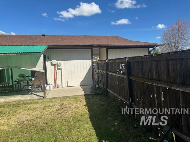 601 Riggs Avenue Emmett, ID 83617 - Photo 12 of 46 Fenced backyard featuring a patio area