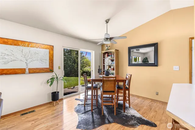 a view of a dining room with furniture window and wooden floor