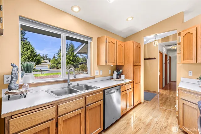a kitchen with a sink and a large window
