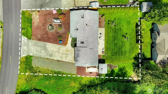 an aerial view of a house with a garden