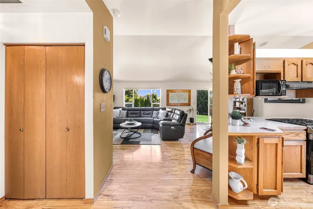 a living room with furniture a rug and white walls