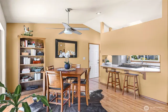 a view of a dining room with furniture window and wooden floor